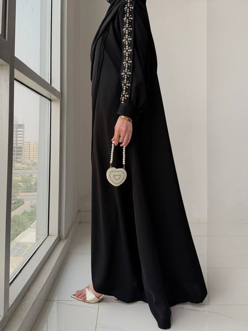 Detailing shot of gold embroidered cuff on Haya Abaya sleeve