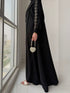 Detailing shot of gold embroidered cuff on Haya Abaya sleeve