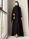 Close up of intricate gold thread embroidery work on black sleeve of Haya Abaya
