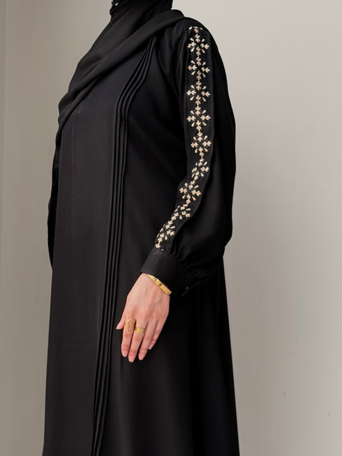 Close up texture shot of premium breathable black fabric used in Haya Abaya