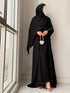 Side view showing graceful flare and front pleats design of Haya Abaya